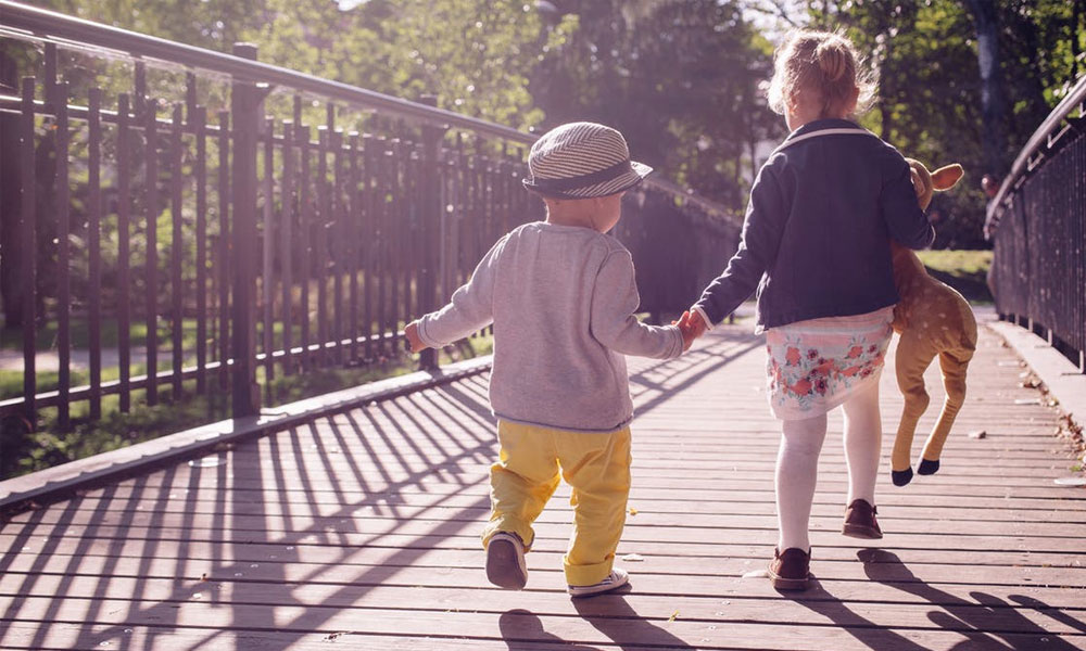 Brother & Sister Playing With Toys
